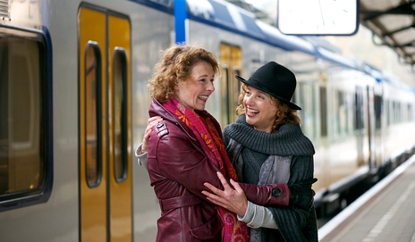 two-friends-travelling-by-train.jpg